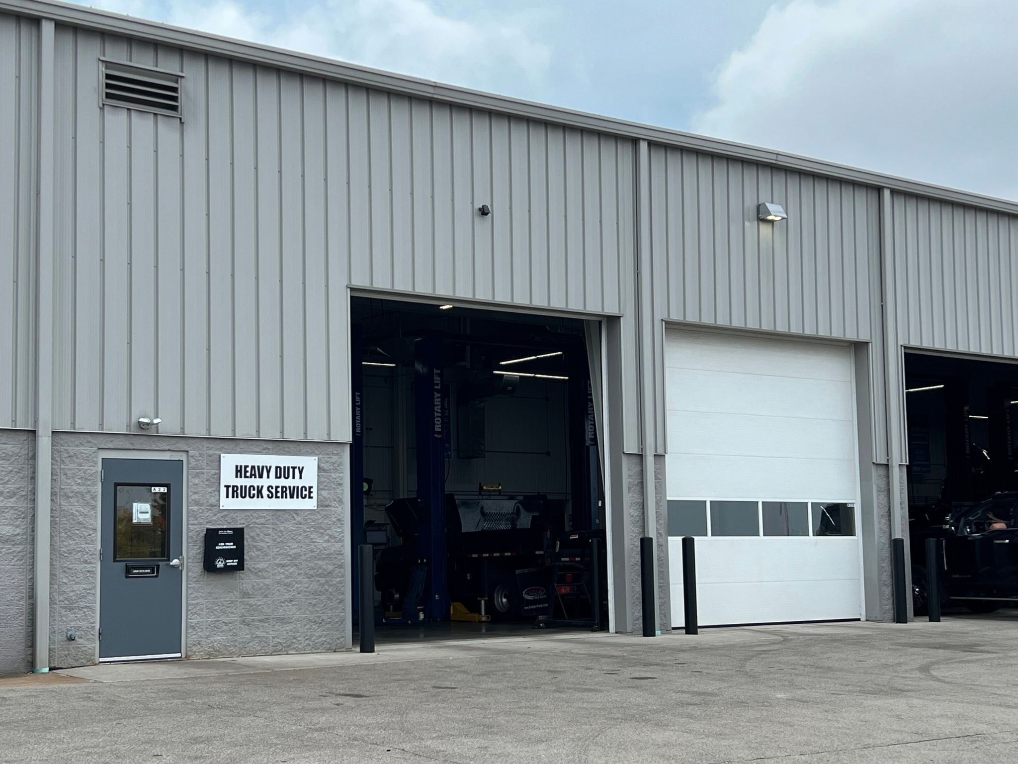 Custom black and gold golf cart parked at Dorsch dealership