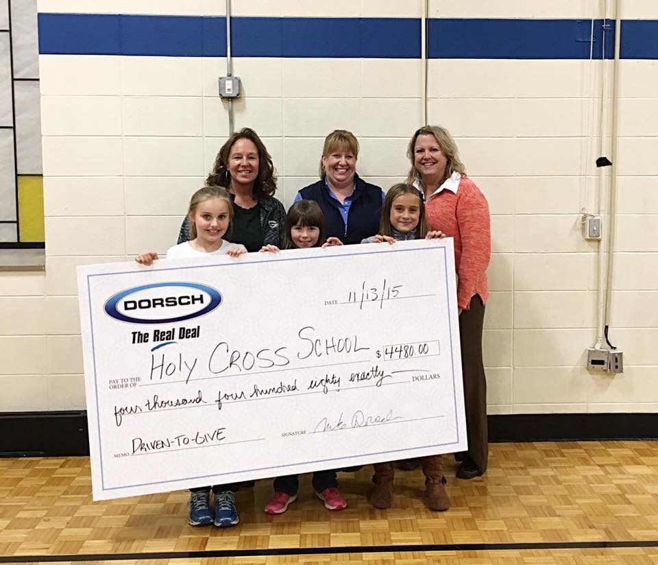 Dorsch Lincoln presents a cheque to the principal of Holy Cross Catholic School for $4,480!