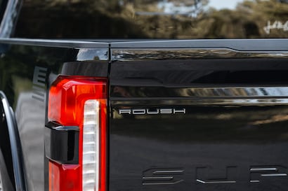 The truck's tailgate featuring the prominent ROUSH logo badge.