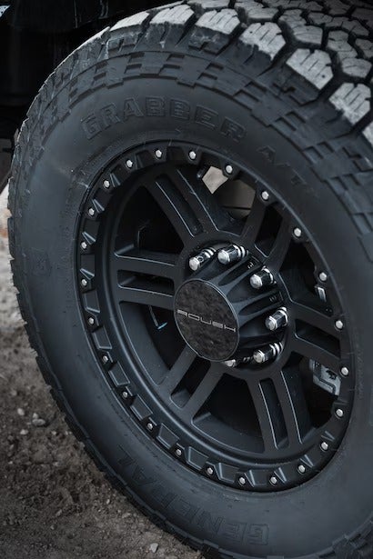 A detailed shot of the ROUSH logo on the wheel's center cap.